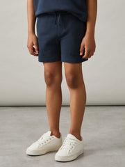 Reiss | 9-13 yrs Cotton Brand-Embroidered Shorts in Washed Navy