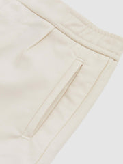 Reiss | 9-13 yrs Relaxed-Fit Pleated Tapered Trousers in Off White