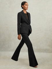Reiss | Wool-Blend Tailored Flared Suit Trousers in Black