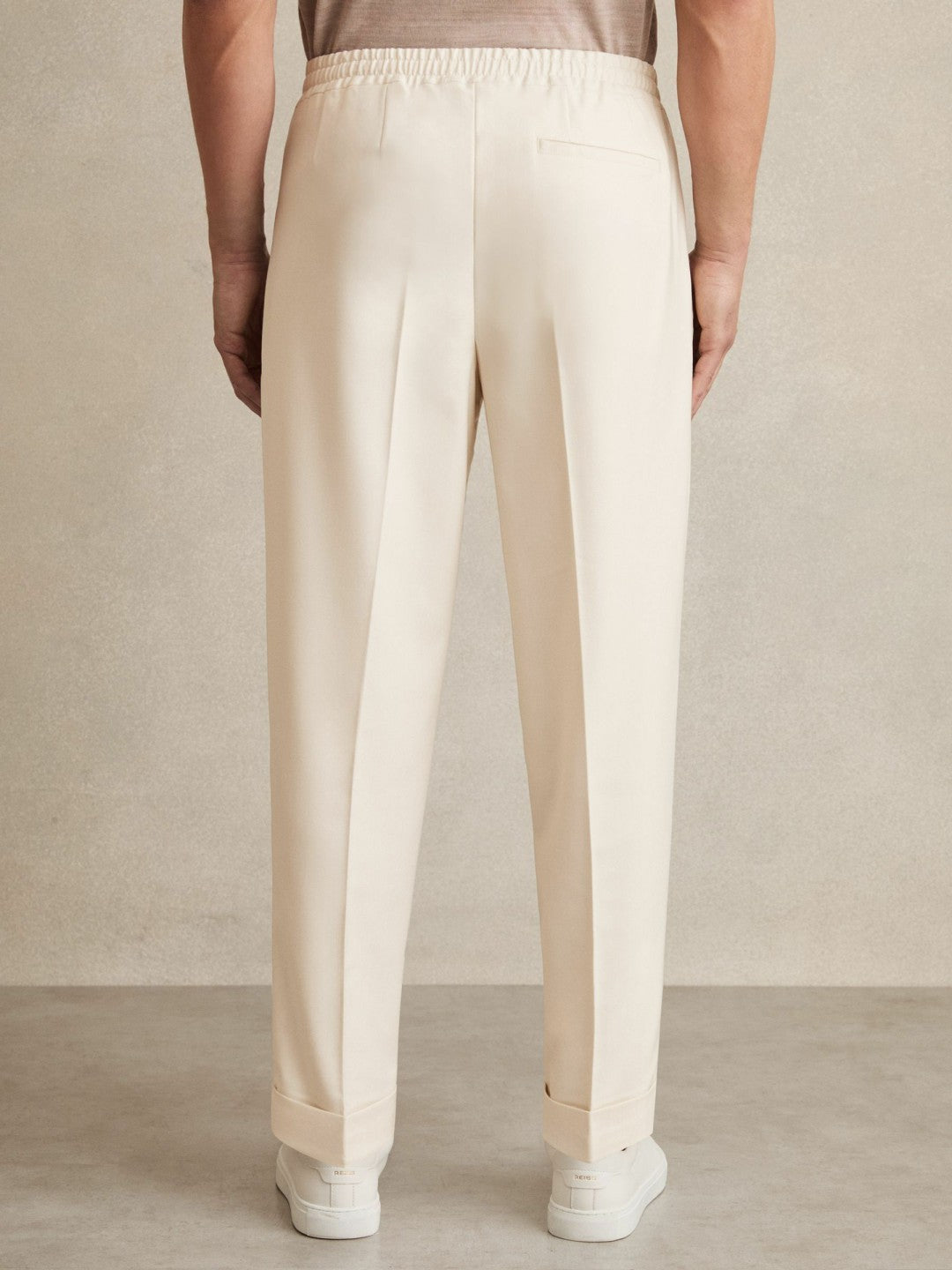 Reiss | Relaxed-Fit Pleated Tapered Trousers in Ecru