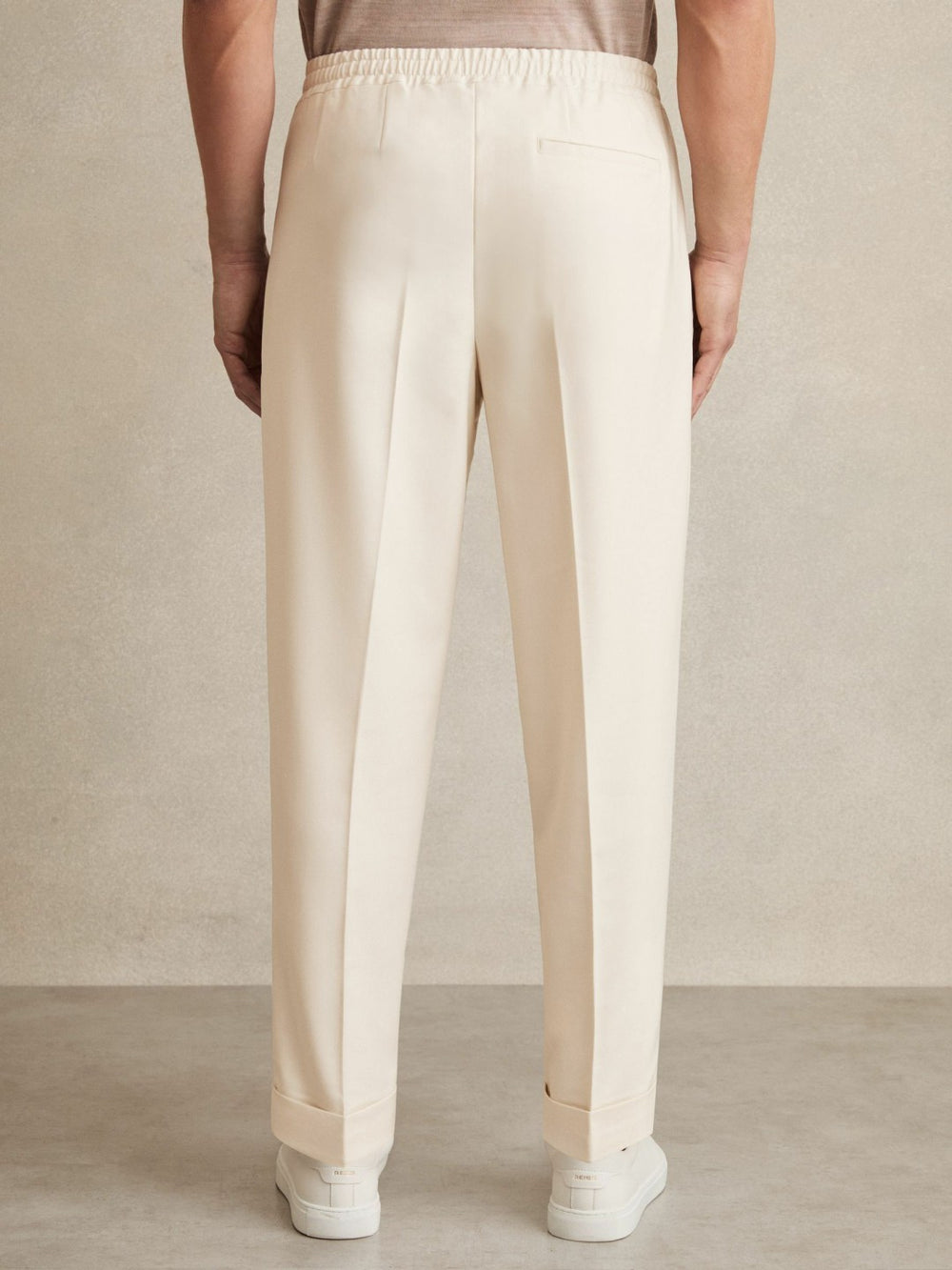 Reiss | Relaxed-Fit Pleated Tapered Trousers in Ecru