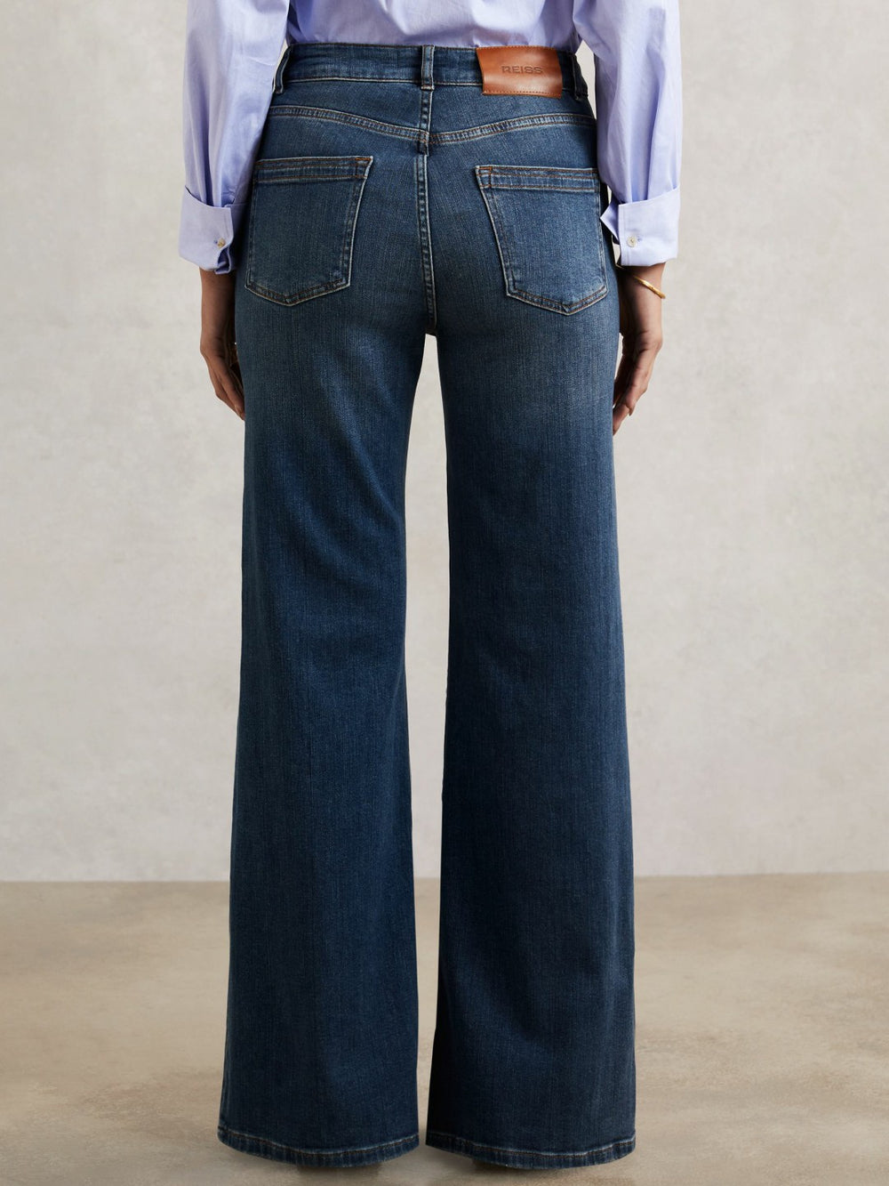Reiss | Petite Mid-Rise Flared Jeans in Mid Blue