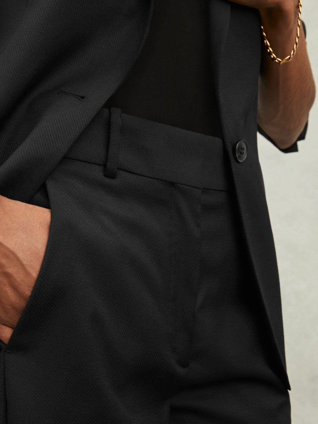 Reiss | Wool-Blend Tailored Flared Suit Trousers in Black
