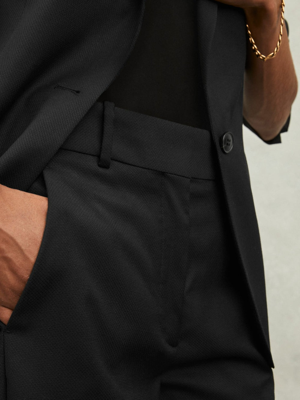 Reiss | Wool-Blend Tailored Flared Suit Trousers in Black
